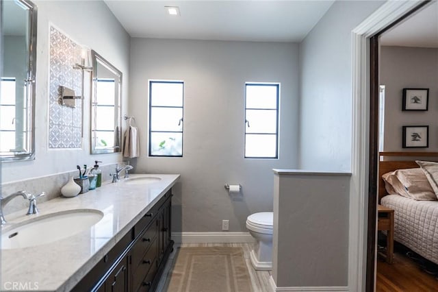 bathroom with toilet and vanity