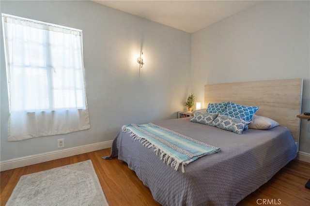 bedroom featuring wood-type flooring