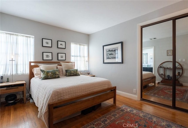 bedroom featuring a closet and hardwood / wood-style floors