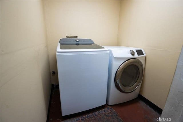 laundry area with washing machine and clothes dryer