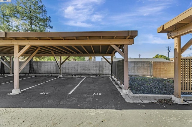 view of parking / parking lot with a carport