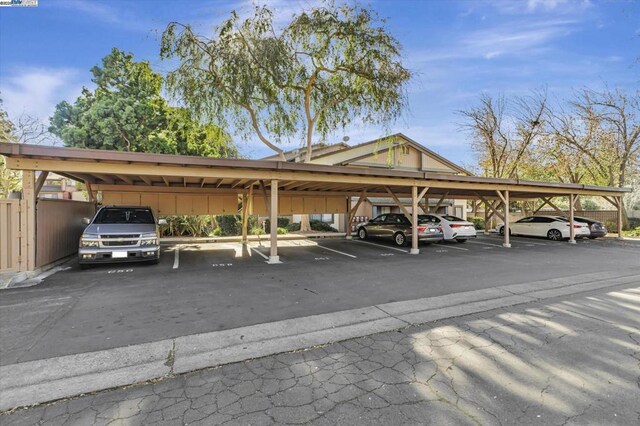 view of parking / parking lot with a carport