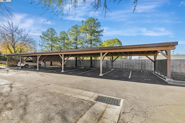 view of parking / parking lot with a carport