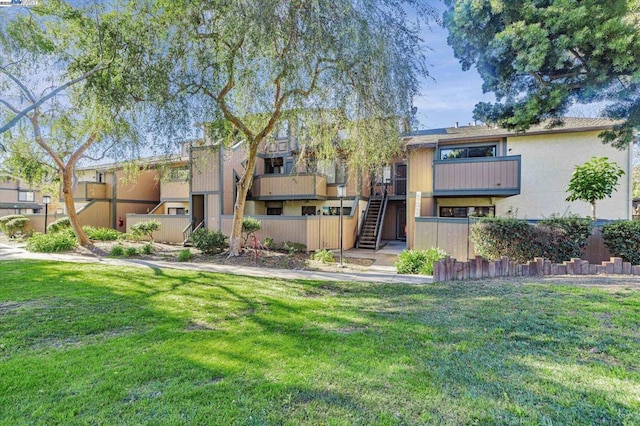 view of home's community with a lawn