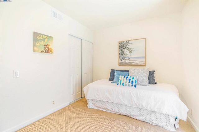 bedroom with carpet floors and a closet