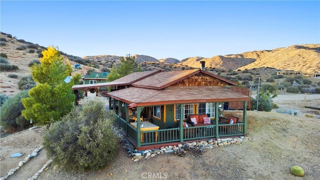 view of front of home featuring a mountain view