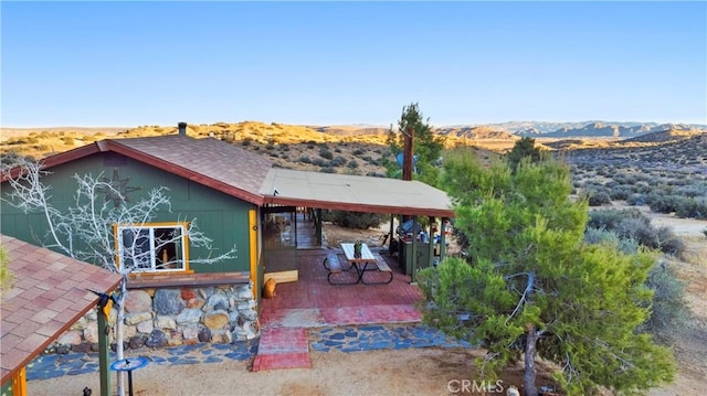 rear view of house with a mountain view