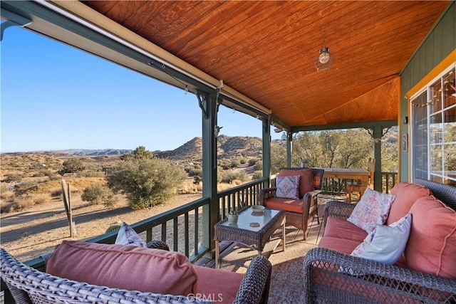 wooden deck featuring an outdoor hangout area