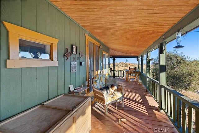 wooden deck with a mountain view