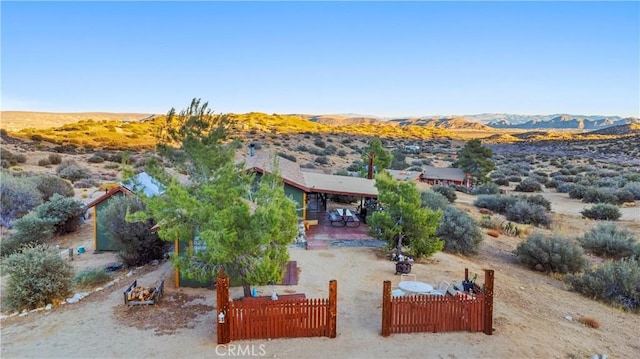 birds eye view of property with a mountain view