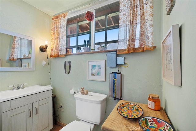 bathroom featuring toilet and vanity