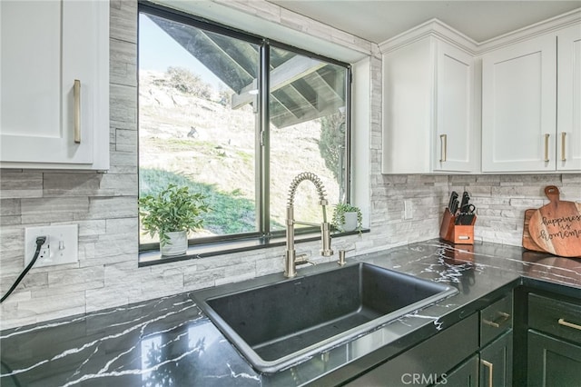 42893 Long Hollow Dr, Coarsegold, CA 93614 - kitchen featuring sink, white cabinetry, and tasteful backsplash