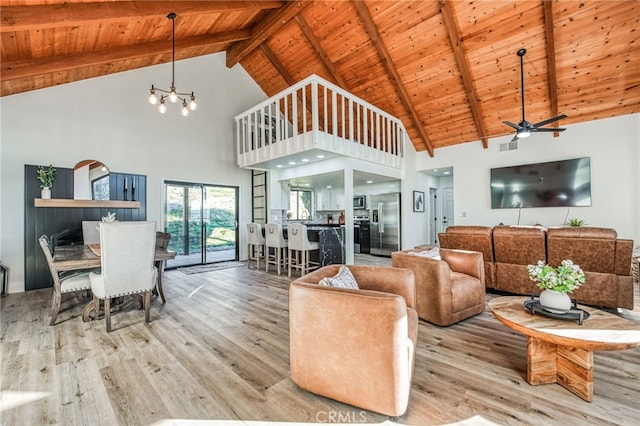 42893 Long Hollow Dr, Coarsegold, CA 93614 - living room with high vaulted ceiling, beamed ceiling, and light hardwood / wood-style floors