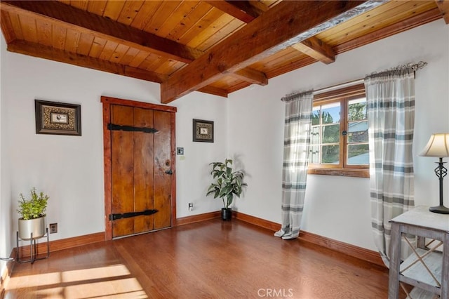 entrance foyer with beam ceiling, wood-type flooring, and wood ceiling