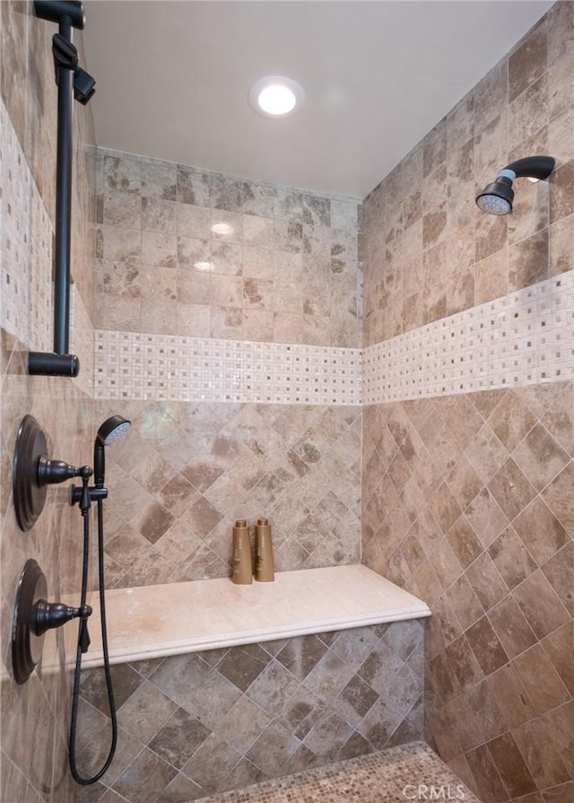 bathroom featuring tiled shower