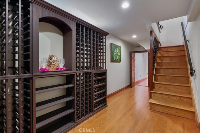 wine area with wood-type flooring