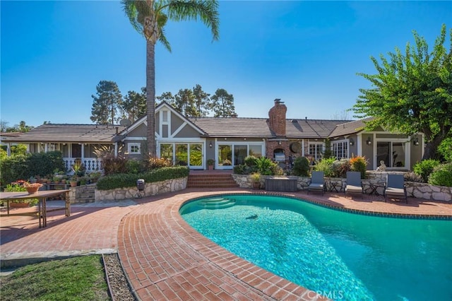 view of swimming pool with a patio area