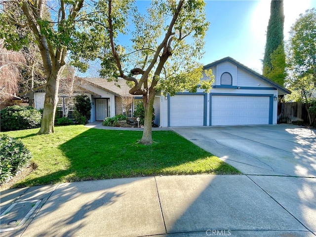 ranch-style house featuring a front lawn and a garage