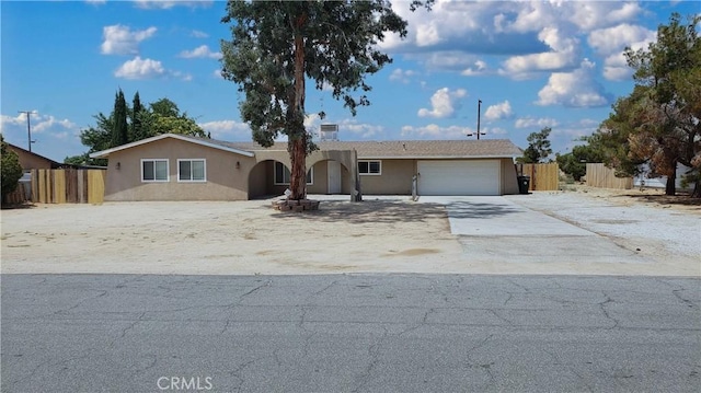 single story home featuring a garage