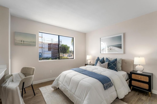 bedroom with hardwood / wood-style floors