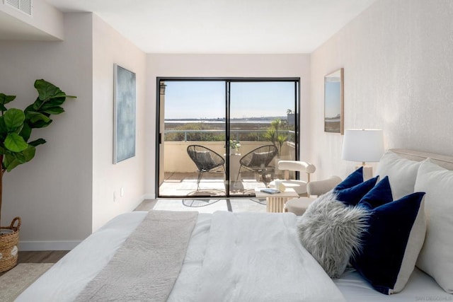 bedroom featuring light hardwood / wood-style flooring and access to outside