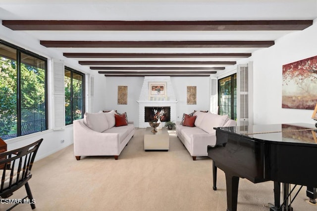 carpeted living room with beam ceiling and a fireplace