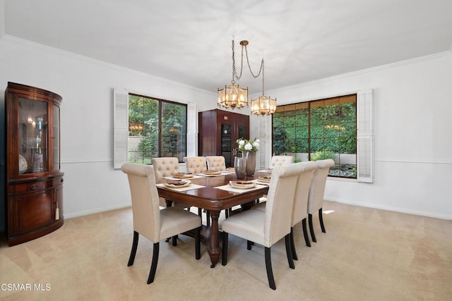 carpeted dining room featuring ornamental molding and a notable chandelier