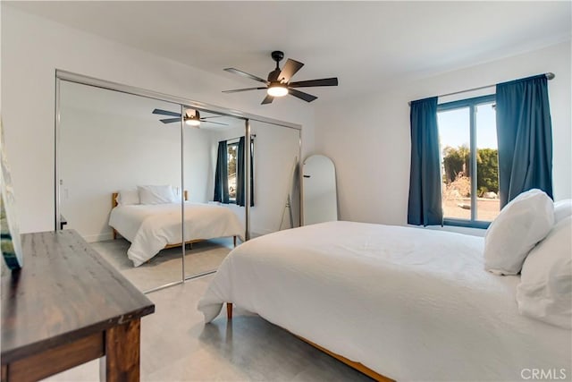 bedroom featuring ceiling fan and a closet