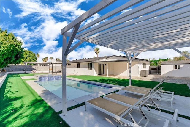 view of swimming pool featuring a lawn, a pergola, and a patio area