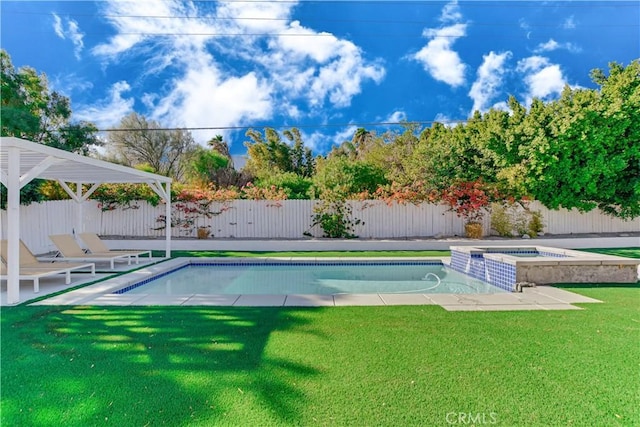 view of pool with an in ground hot tub and a yard