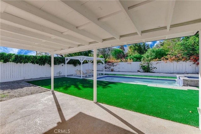 exterior space with a fenced in pool and a patio