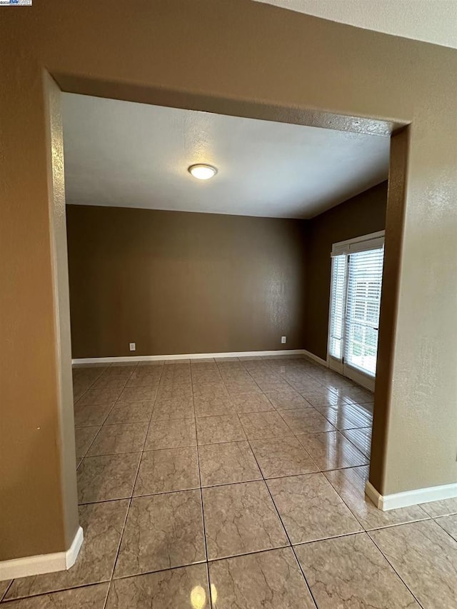 view of tiled spare room