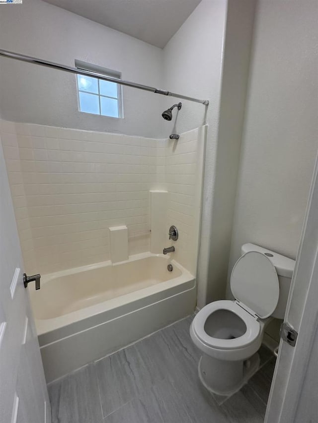 bathroom with toilet and shower / bath combination