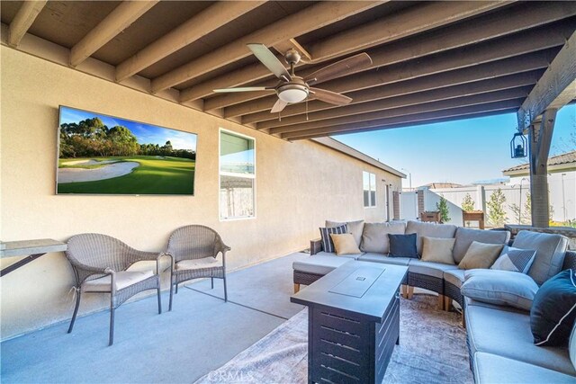 view of patio with ceiling fan and an outdoor living space