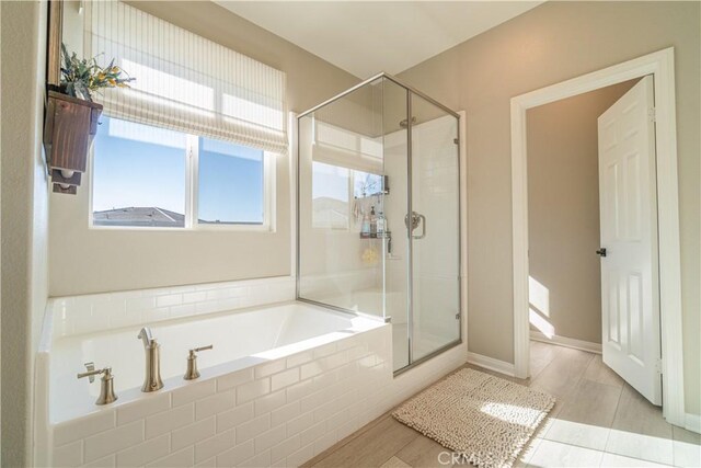 bathroom featuring plus walk in shower