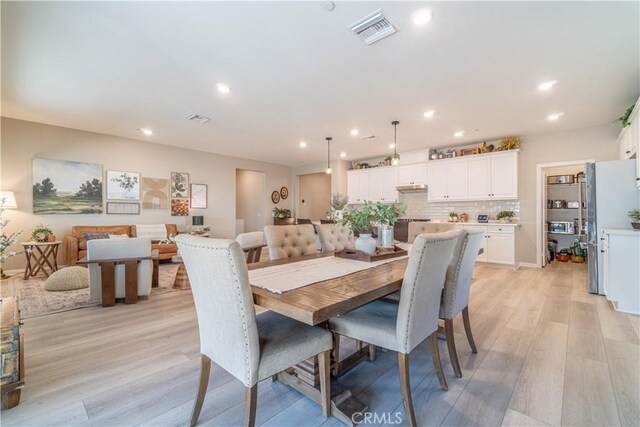 dining room featuring light hardwood / wood-style flooring