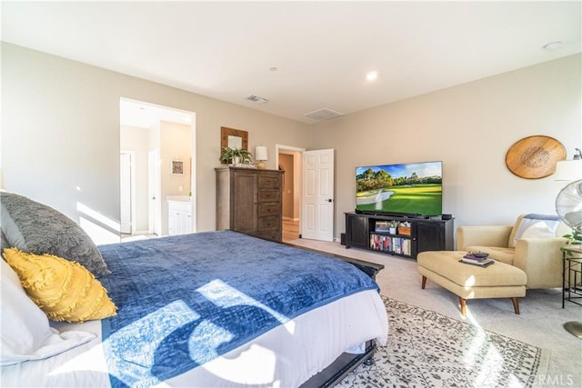 bedroom with light colored carpet