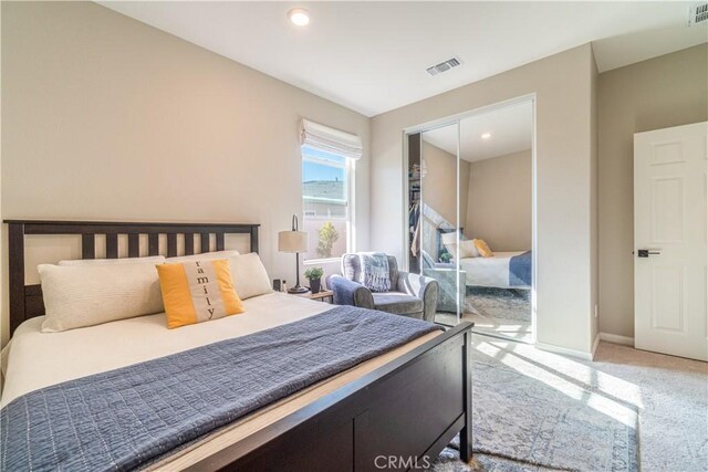 bedroom with a closet and carpet