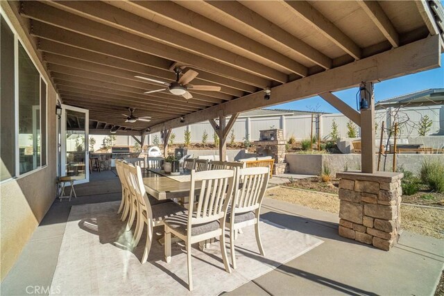 view of patio featuring exterior kitchen and ceiling fan