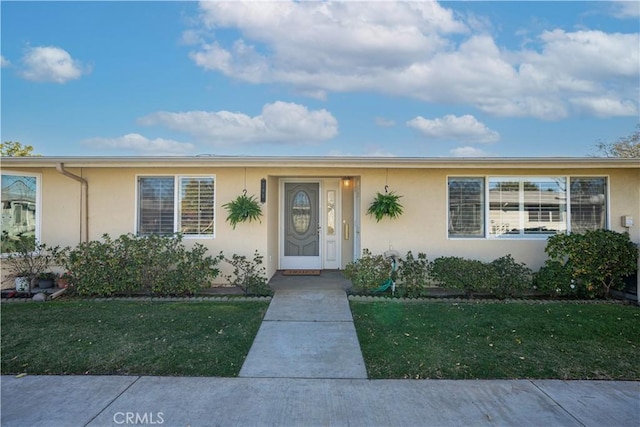 view of front of home with a front yard