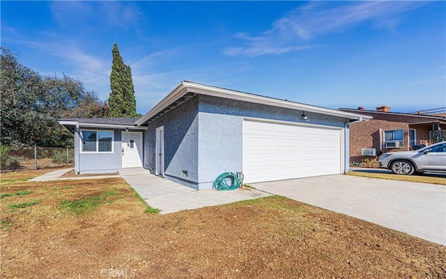 view of front of property with a front lawn and a garage