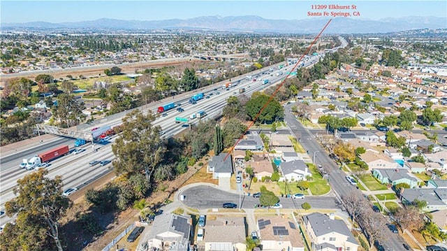 birds eye view of property with a mountain view