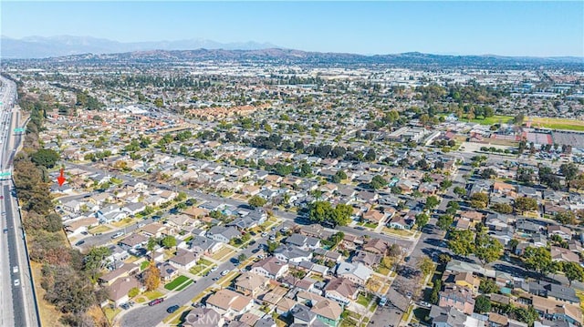 drone / aerial view featuring a mountain view