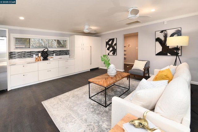 living room featuring ceiling fan, dark hardwood / wood-style flooring, and crown molding