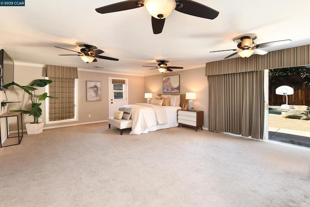 carpeted bedroom with crown molding and access to outside