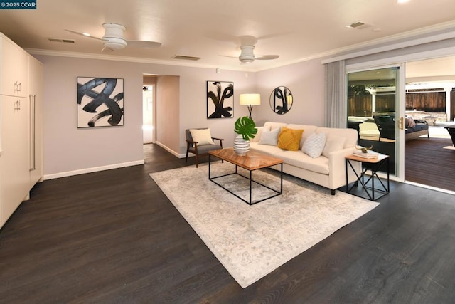 living room with ceiling fan, dark hardwood / wood-style flooring, and crown molding