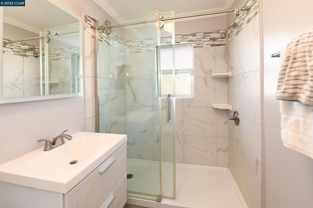 bathroom with vanity, crown molding, and walk in shower