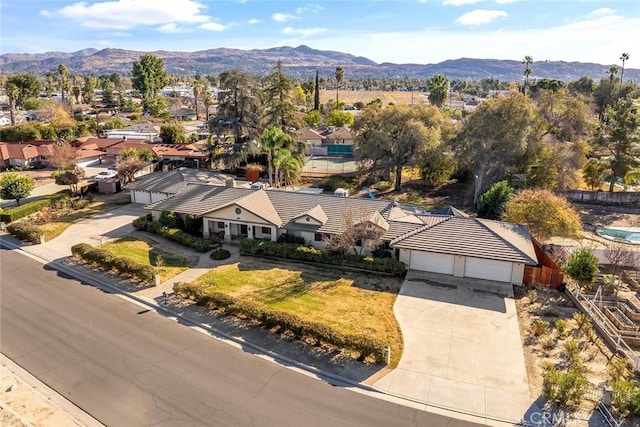 birds eye view of property featuring a mountain view