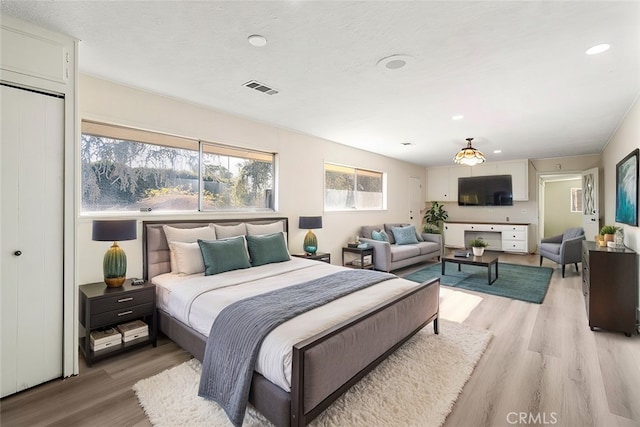 bedroom featuring light hardwood / wood-style flooring