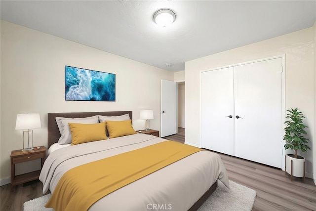 bedroom featuring hardwood / wood-style flooring and a closet